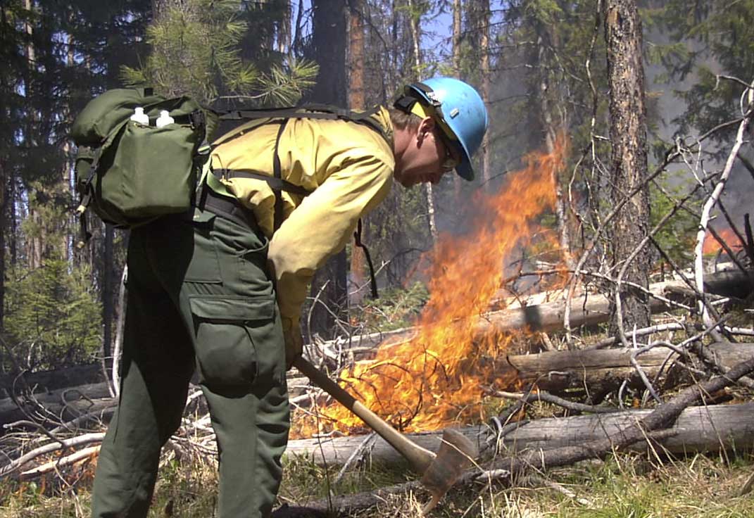 Training Foreman Brett Rogers assists with a prescribed fire operation on the Nez Perce National Forest